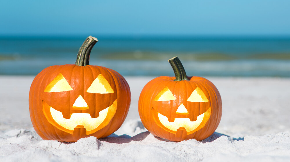 Halloween jack-o'-lanterns lined up on the Pattaya beach