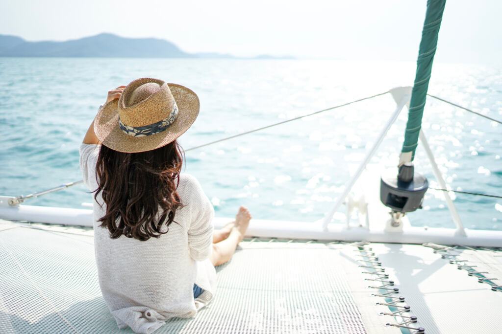 A woman enjoying a luxury yacht cruise in Na Jomtien Pattaya