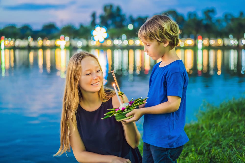 Mom and Son holds Loy Krathong in Pattaya.