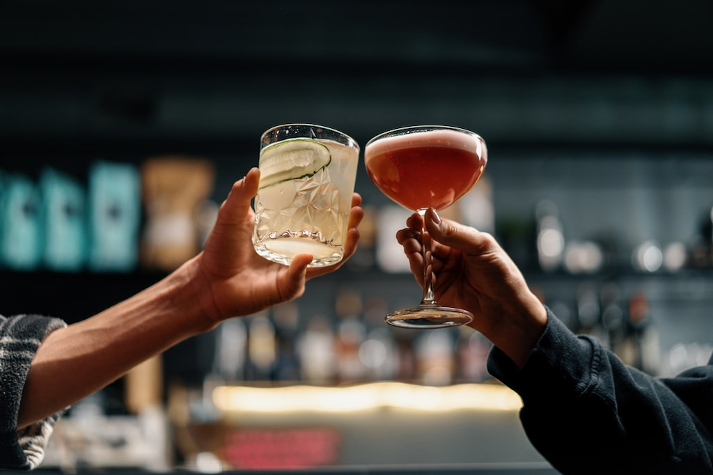 Two people cheering cocktails in Pattaya